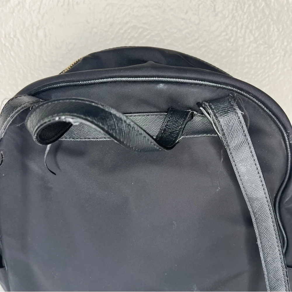Kate Spade black gold zippers back pack
